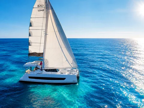 Passengers relaxing on deck during the Frioul Islands catamaran cruise